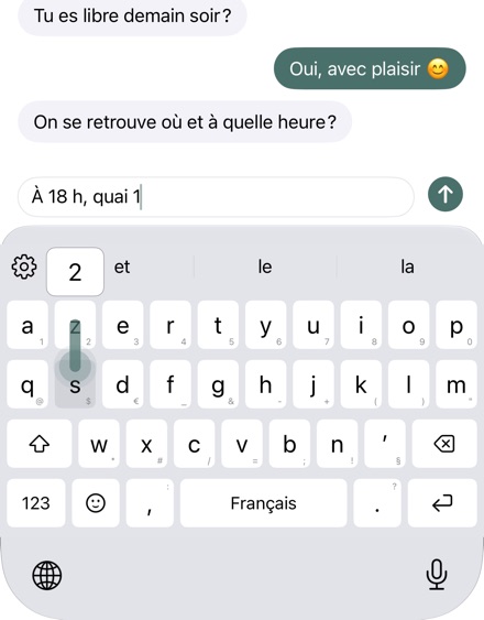 Glissement vers le bas sur une touche : l’aperçu montre le caractère.